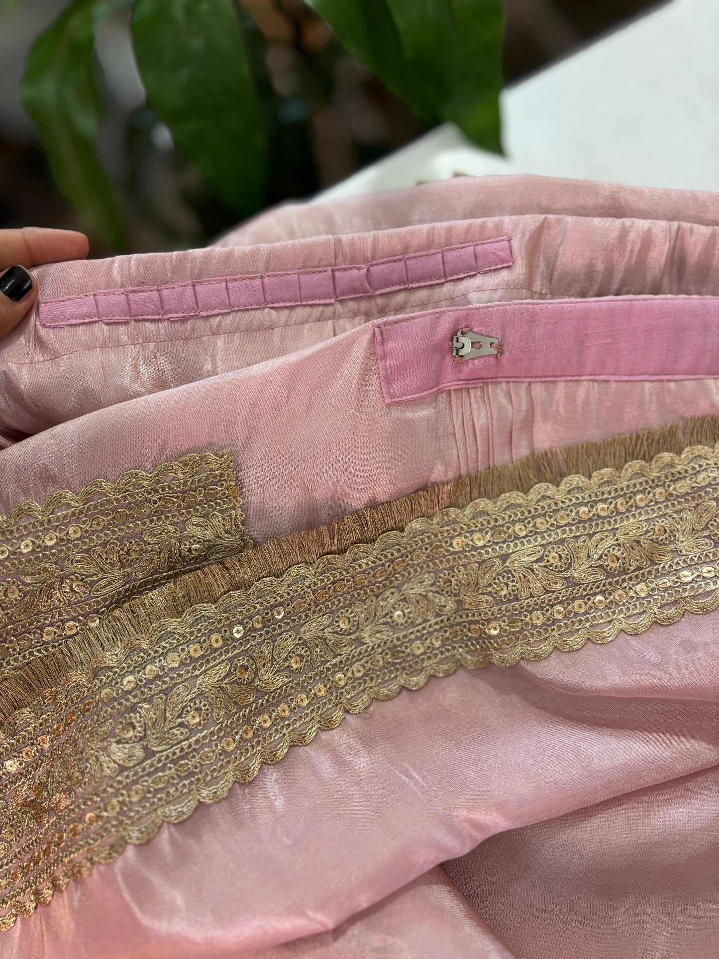 Baby pink tissue pre-draped saree with golden borders