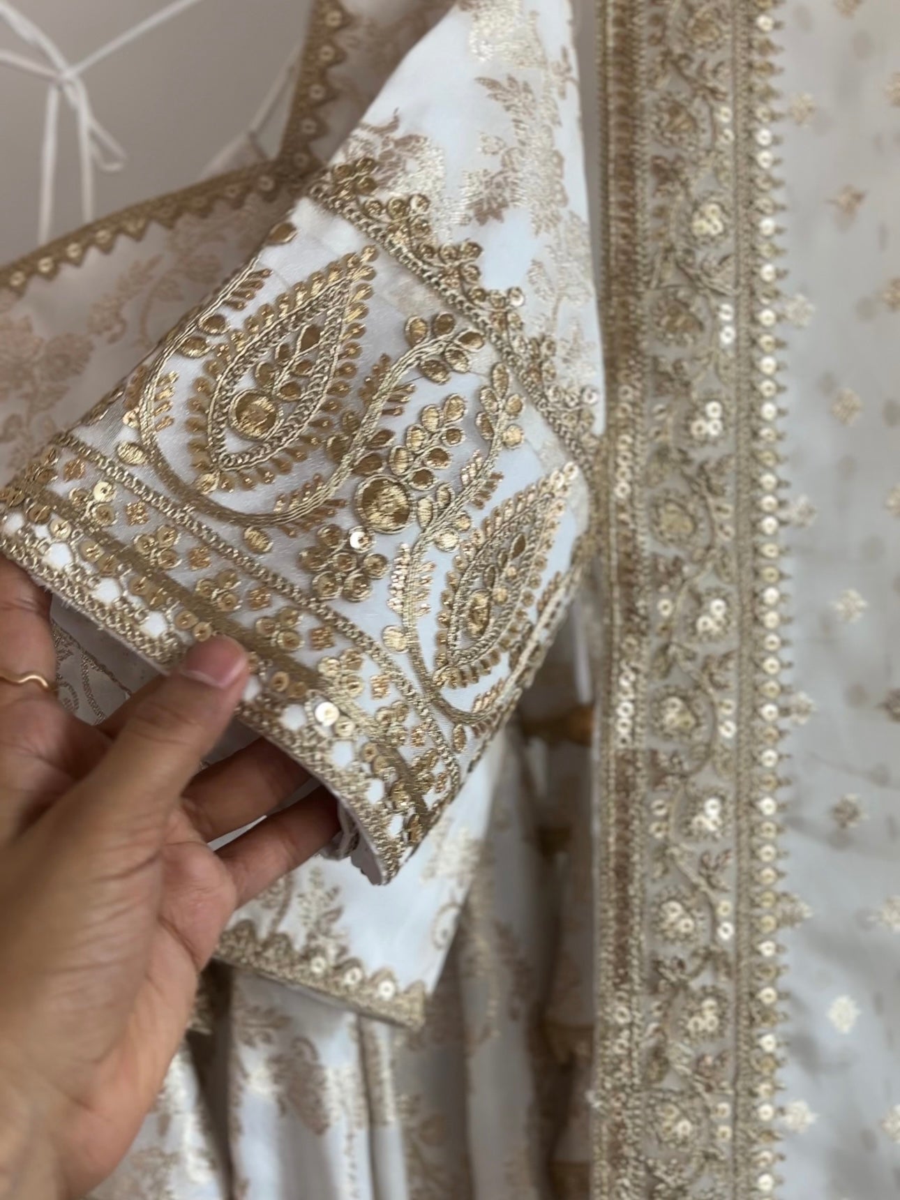 White and gold dola silk lehenga set