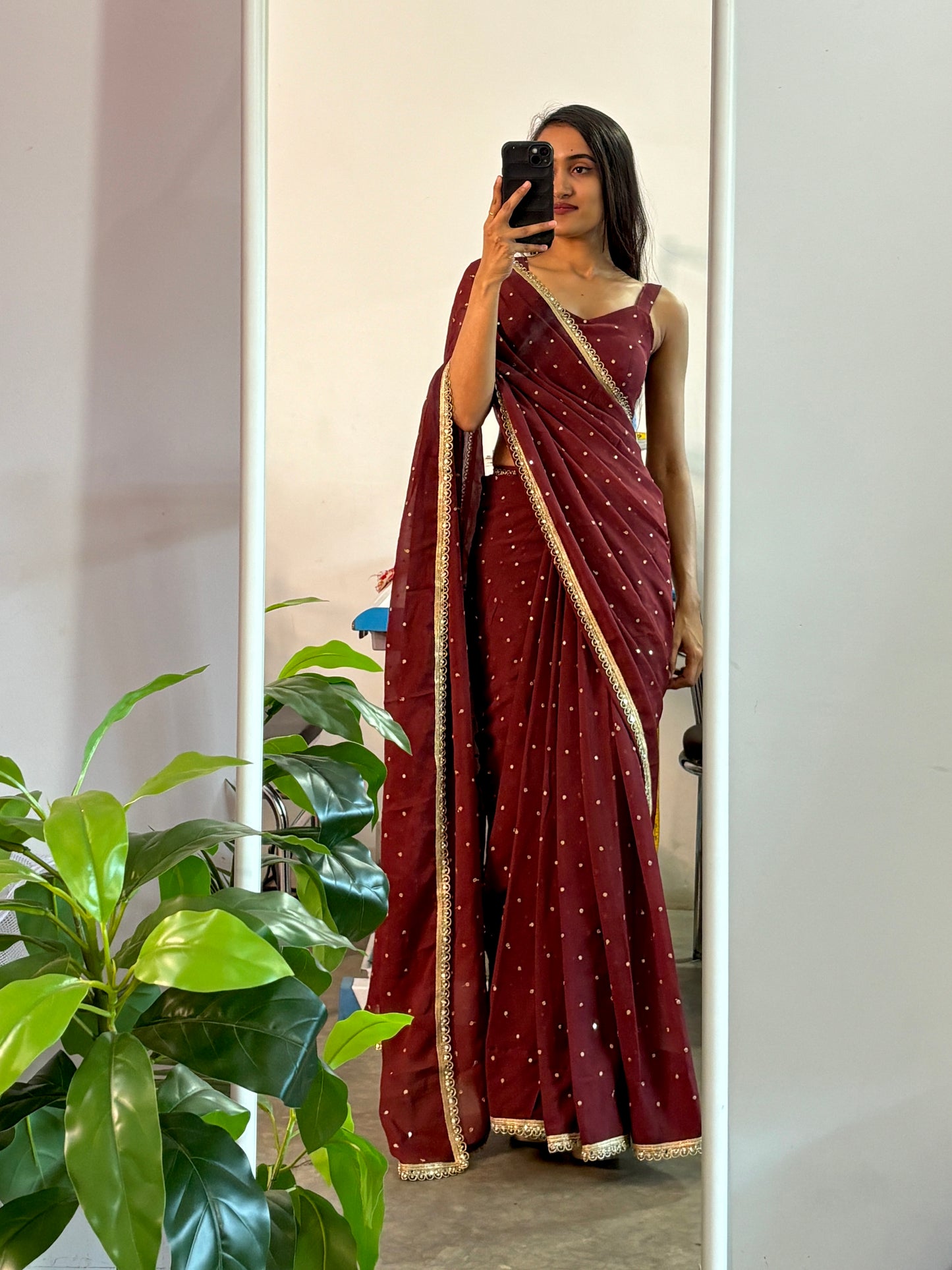 Georgette sequinned predraped saree.