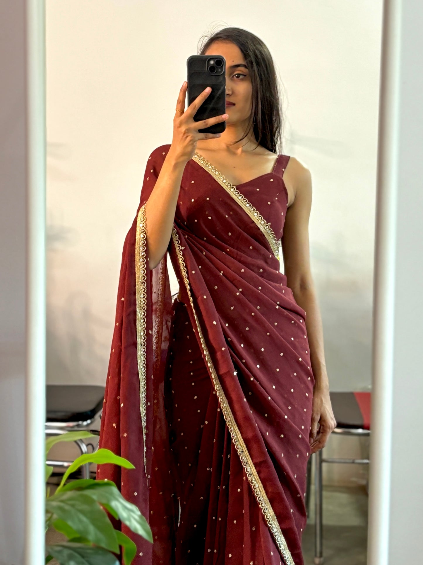 Georgette sequinned predraped saree.