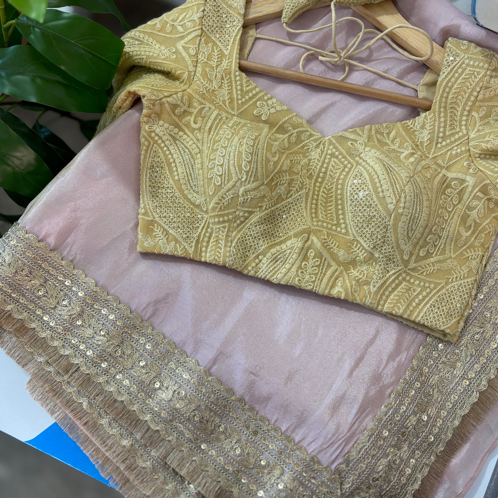 Baby pink tissue pre-draped saree with golden borders