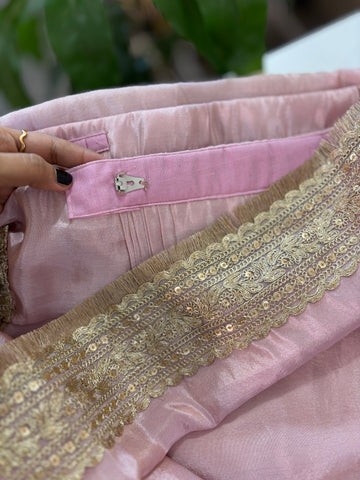 Baby pink tissue pre-draped saree with golden borders