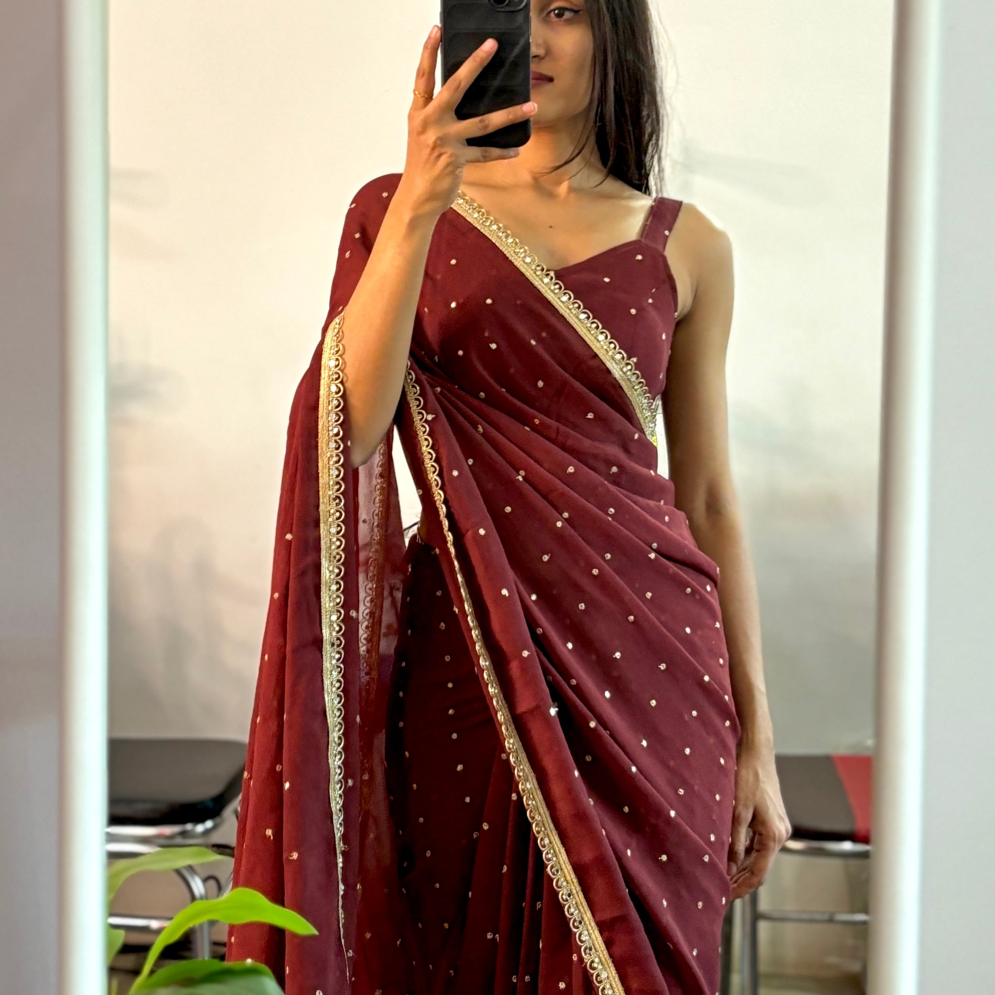 Georgette sequinned predraped saree.