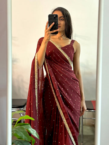 Georgette sequinned predraped saree.