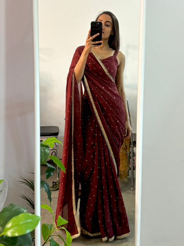 Georgette sequinned predraped saree.